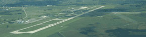 Picture of an airport from a plane.